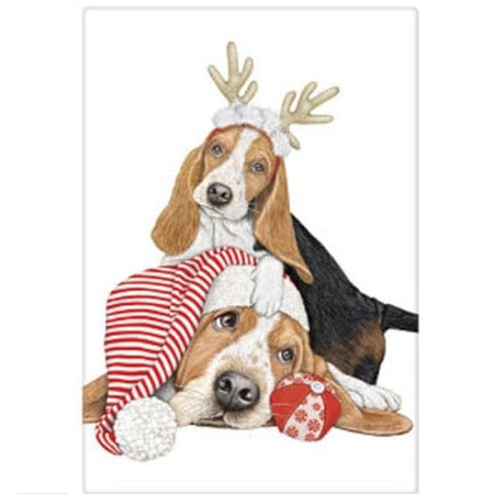 white kitchen towel with 2 basset hounds. One wiht antlers and one with a knit hat in red and white stripe.