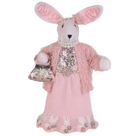 Standing rabbit figured dressed in a full lengh pink dress with matching textured jacket.  She has pink ears and wears pearls, and carries a purse.
