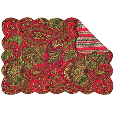 rectangle shaped placemat in red and green paisley with a corner folded over showing reverse side in red white and green stripes
