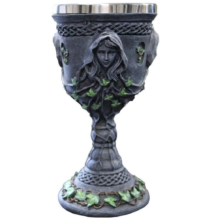 grey goblet with green leaf design as well as "carved" mother maiden and crone faces.