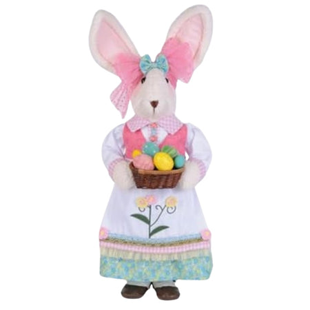 White bunny with pink ears wearing a white dress with pink best. She carries a basket of painted Easter eggs. 
