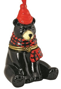 black bear ornament wearing a red hat and black and red plaid scarf