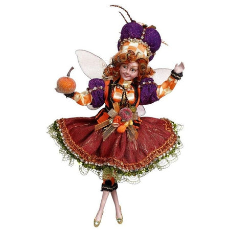 Red haired pumpkin princess fairy with a festive outfit on.