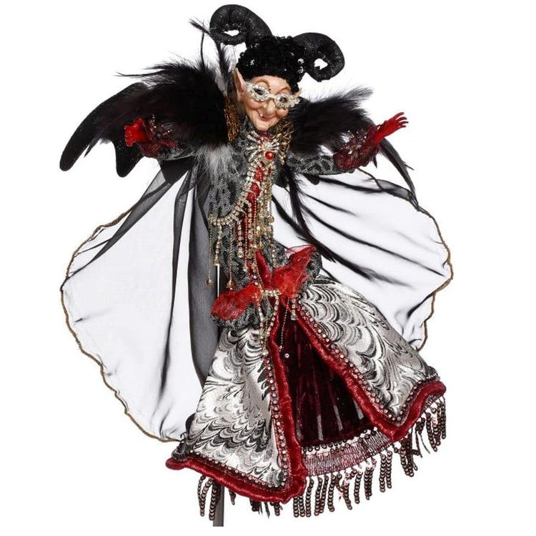 Pointy eared witch with a black, red & white outfit and wings.