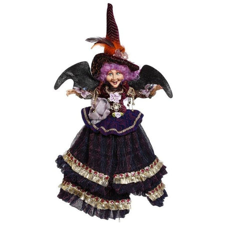Purple haired witch with a purple & black embellished dress.