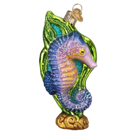 Ornament with a seahorse in front of green seaweed or other fauna.  Blue, purple and greens