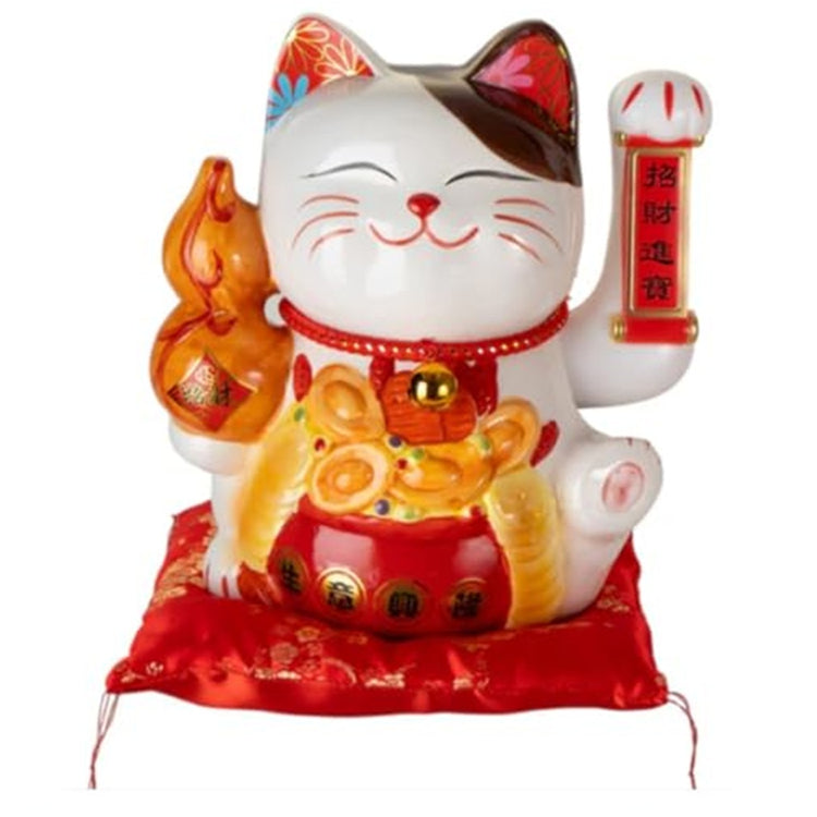 White cat on a red pillow wiht foreign symbols and pot of gold
