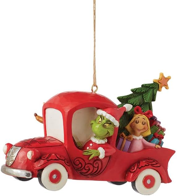 Decorative ornament of a red truck with characters from 'How the Grinch Stole Christmas'.
