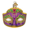 Mardi Gras mask ornament with silver top and gold heart charm. The ornament is gold with a purple mask, green glitter decoration around the eyes and a pink bead top center.