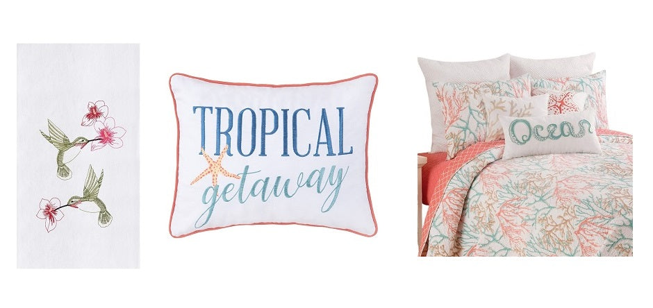 White towel with hummingbirds, white pillow that says "tropical getaway" and a coral print bedspread