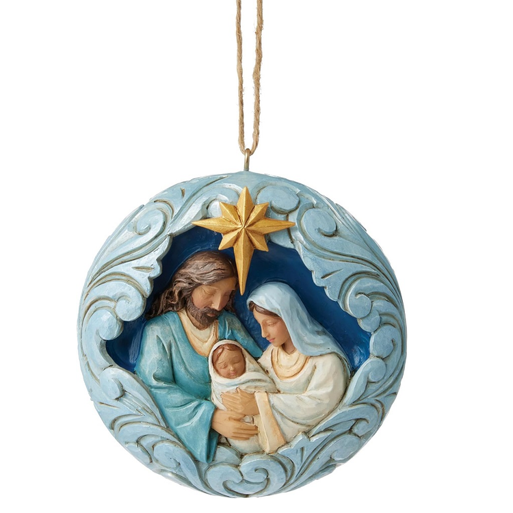 Decorative ornament with Joseph, Mary, and baby Jesus with a gold star on a white background