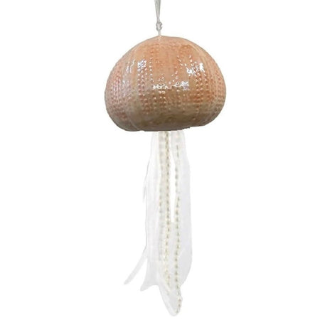 blown glass jellyfish ornament, the body is a light peachy pink, and the tentacles are made of white ribbon and beads.