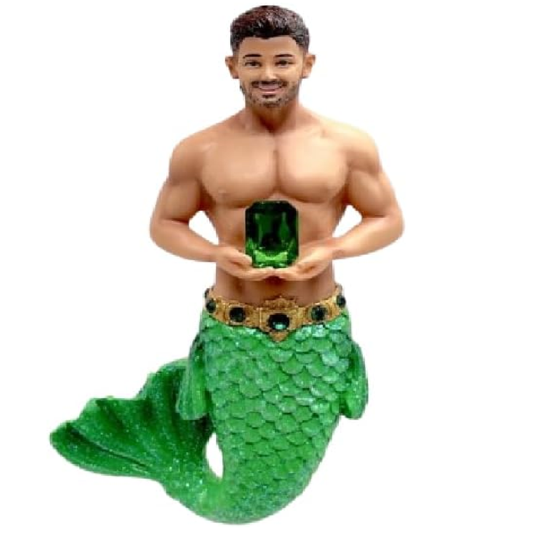Merman figurine with a green tail and holding a green gemstone on a white background