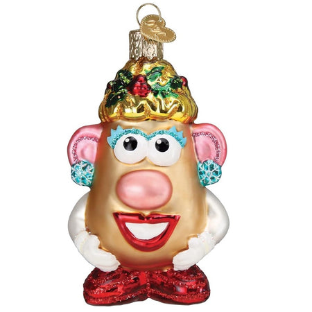 Blown glass ornament of Mrs. Potato Head, with holly in her hair and blue snowflake earrings on.