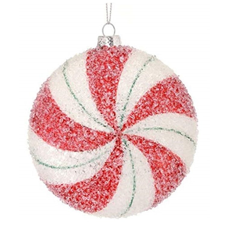 Round ornament that looks like a red and white peppermint with a sugar coating.