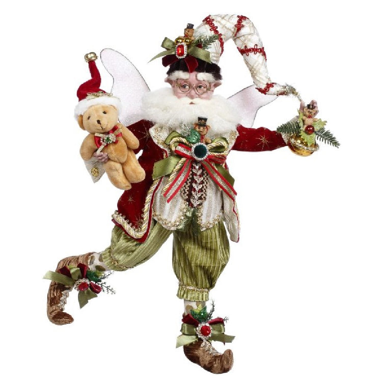 bearded fairy wearing red jacket, green pants, a white and red stocking cap... all are embellished with ribbons, jewels and teddy bears.