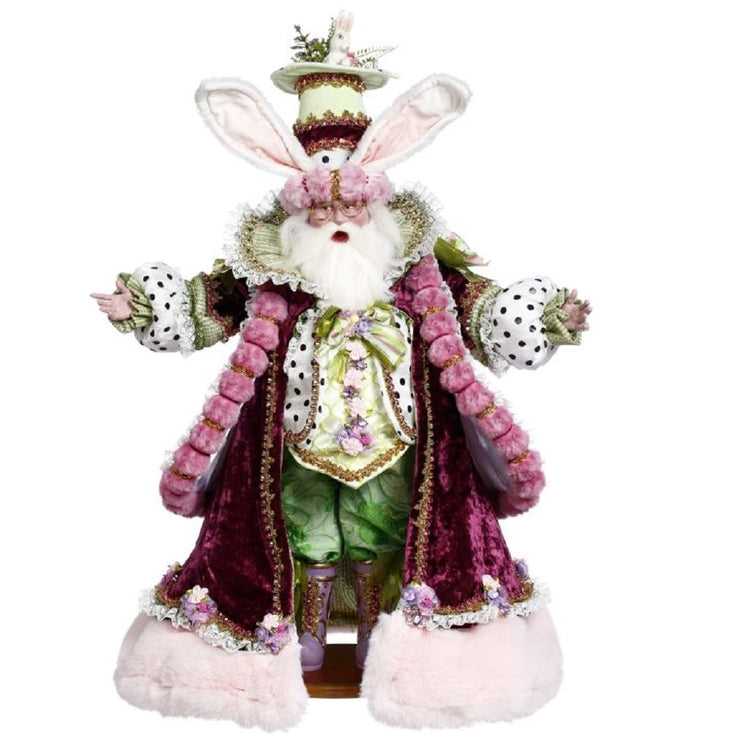 Father Easter figurine in a velvet pink coat & bunny ear hat.