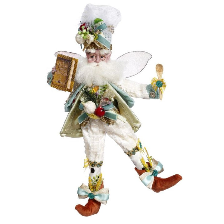 Fairy with white & blue outfit & chef hat & book.
