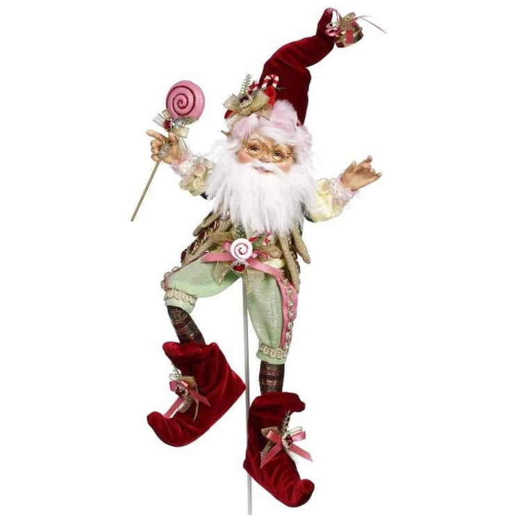 Bearded elf with a red, pink & light green costume with lollipops. 