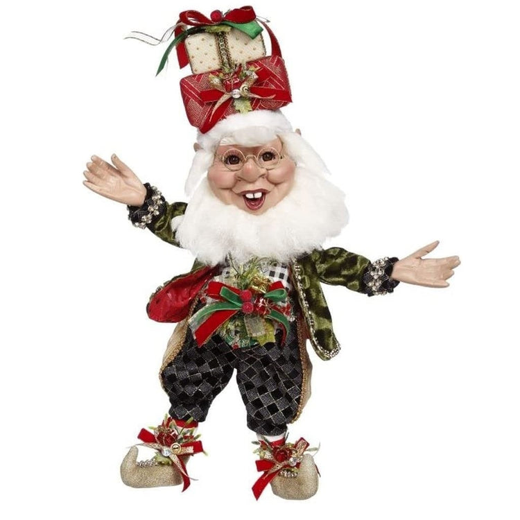 White bearded elf with a gift on his head & a black harlequin outfit.