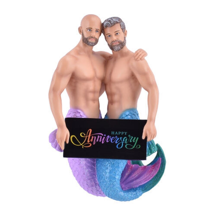 2 mermen with a blue & purple tail & happy anniversary sign.