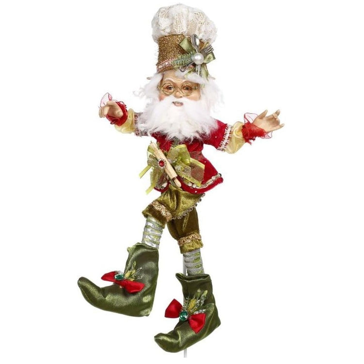 White bearded elf with green & red shoes, outfit & hat.