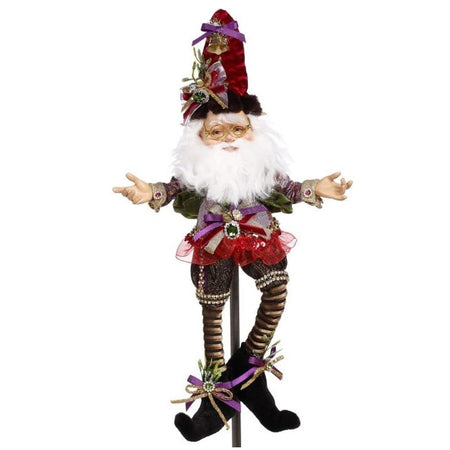 White bearded elf with a gold, red & purple outfit on.
