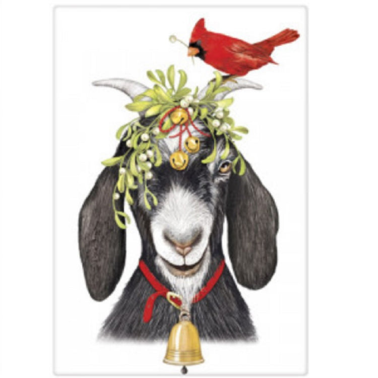 White flour sack dish towel with black and white goat face. Goat is wearing a bell collar and has bells, mistletoe and a red cardinal on his head.