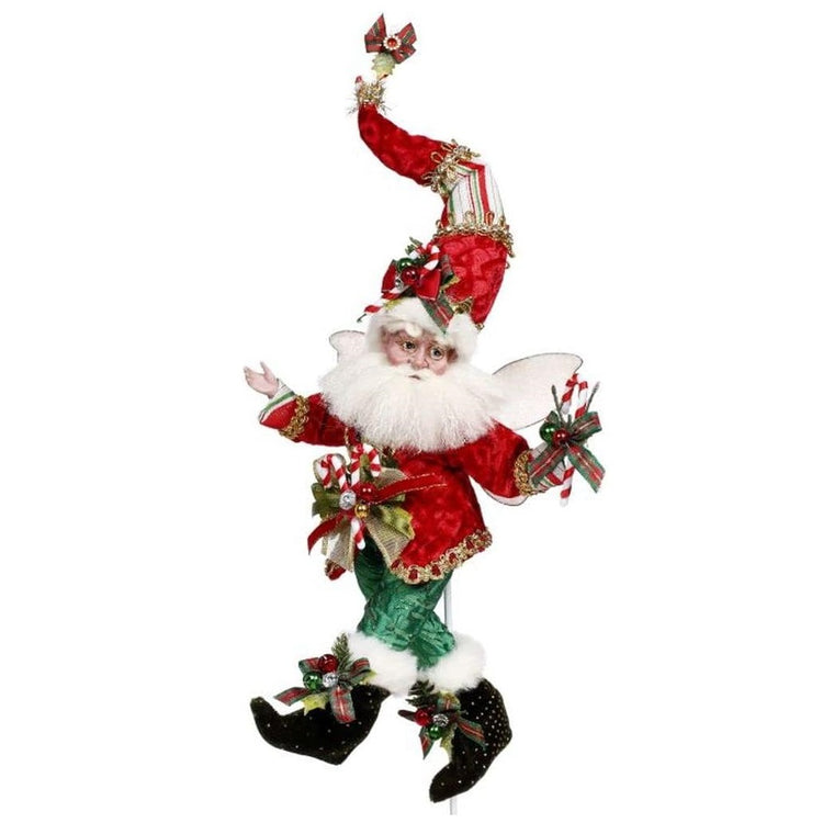 White bearded fairy with a red, green & gold festive Christmas oufit.
