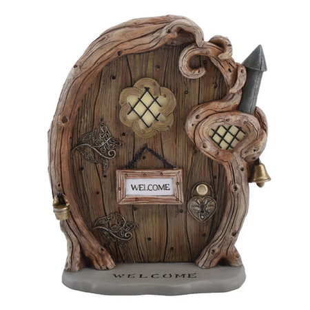 resin fairy door decoration, made to look like wood, with a little welcome sign and heart shaped key hole.