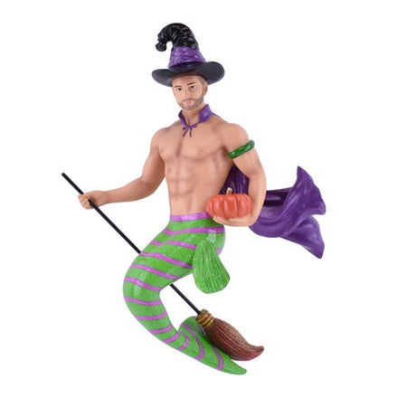 Merman with a green & purple tail, cape & witch hat on a broom.