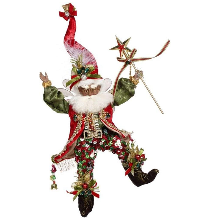 African American bearded fairy wearing a red vest, stocking cap and sequined pants, holding a wand with star topper.