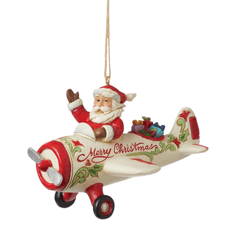Christmas ornament featuring Santa Claus on an airplane with 'Merry Christmas' text.