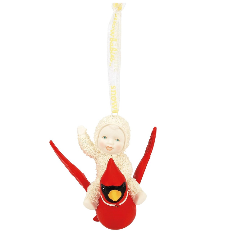Decorative Snowbaby riding a cardinal ornament on a white background
