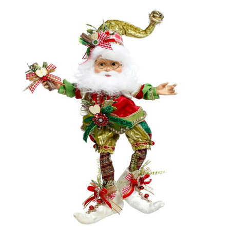 bearded elf wearing green and red outfit, adorned with apple slices and cinnamon sticks.