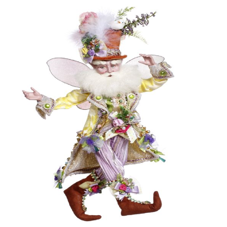 Bearded fairy wearing light purple pants, yellow jacket, and brown top hat adorned with flowers.