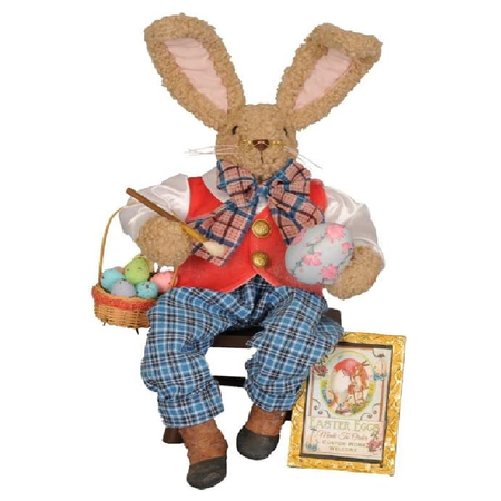 Bunny rabbit figurine in a red shirt and blue plaid pants with a basket of Easter eggs on a white background.