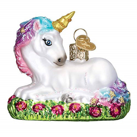 White unicorn lying down in a flower bed.  Pin and blue main with gold horn.
