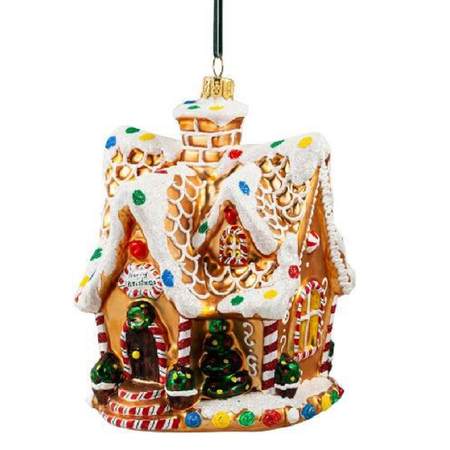 A gingerbread house Christmas ornament with white icing details, colorful candy accents, a hanging loop, and a gold finial on a plain white background.