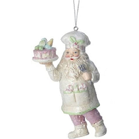 Light pastel colored santa wearing a chefs hat and carrying a cake. Peppermints in his apron pocket