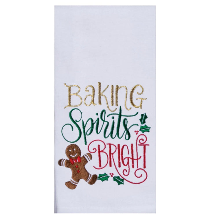 Folded white kitchen towel with a gingerbread man and text: Baking Spirits Bright in red green and gold