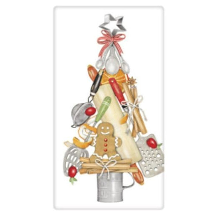 White kitchen towel with baking utensils staked up to resemble a potted christmas tree with a star shaped cookie cutter for the topper.