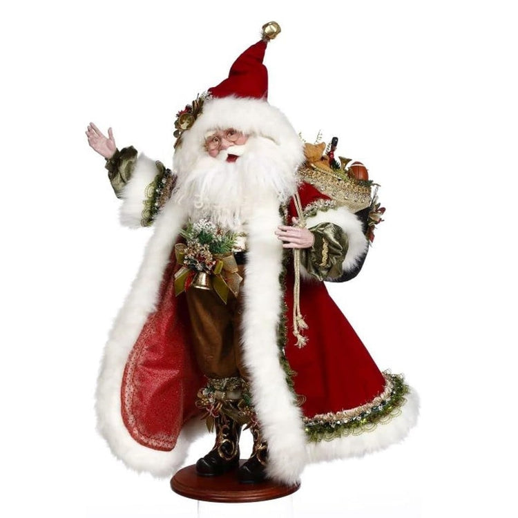 santa in long fur trimmed coat, carrying a sack full of toys on his back.