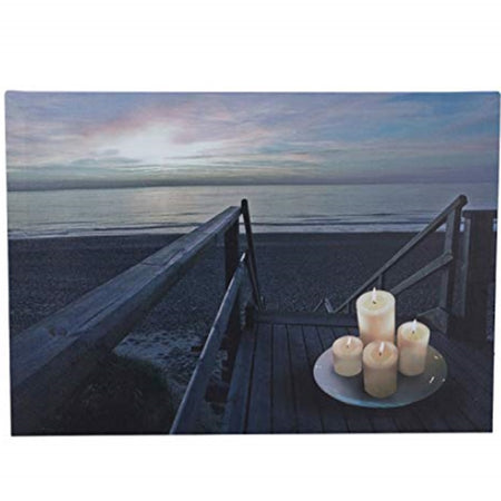 Canvas print of a dock with beach access and the beach.  4 candles are lit on a plate on the dock.