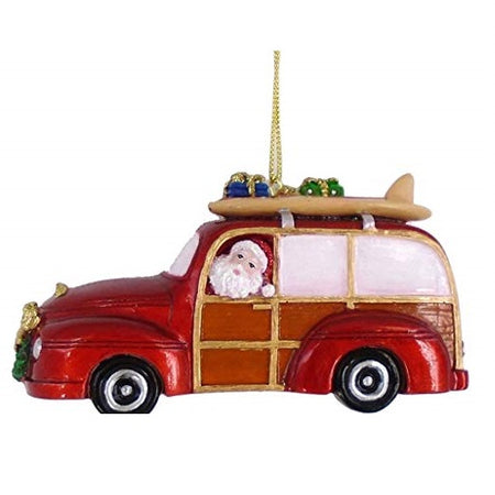 Red beach car shaped Christmas ornament. Santa Claus is driving and has his surfboard on the roof rack with presents.