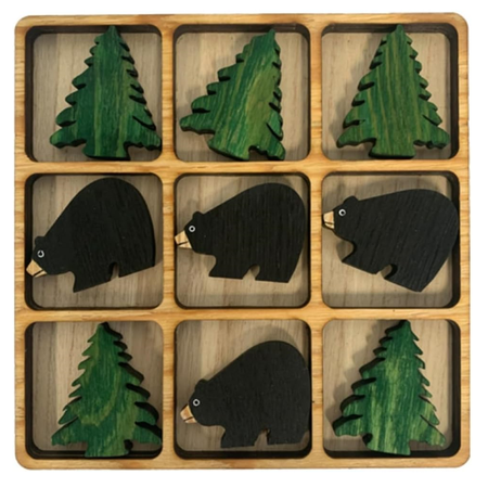 wood tic tac toe board with green pine tree and black bear game pieces. 