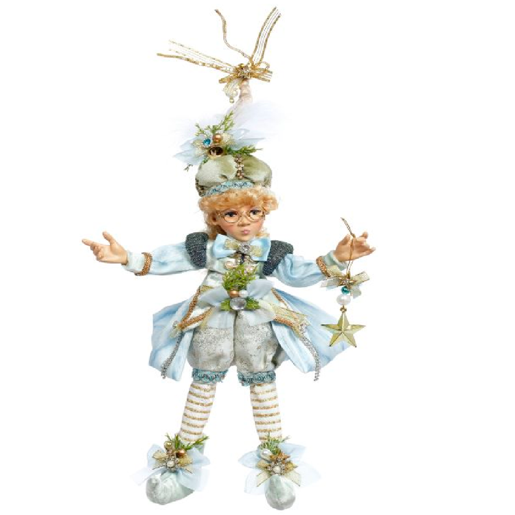 girl elf wearing light blue and white outfit with gold accents and a star ornament.