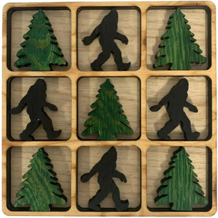 wooden tic tac toe board with green pine tree, and black bigfoot pieces.