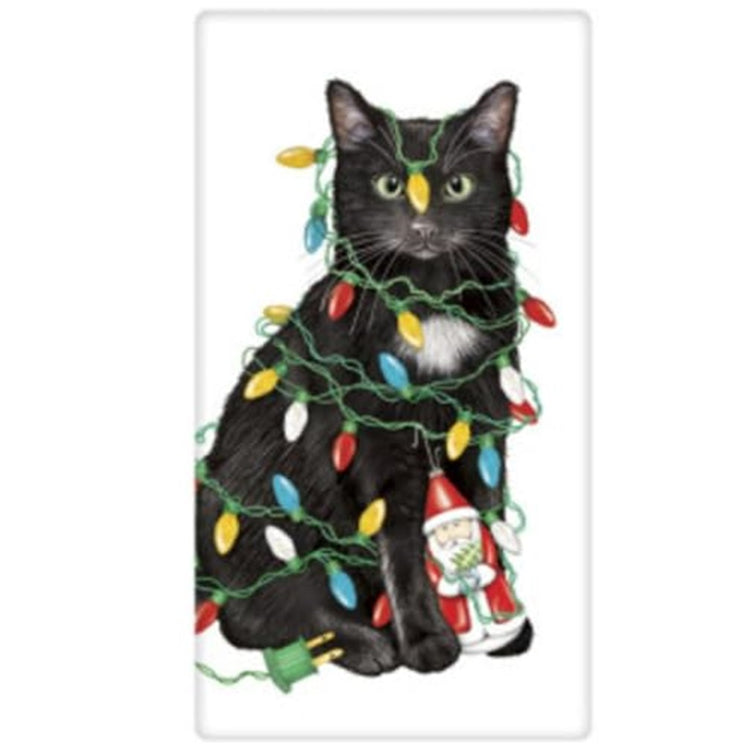 White kitchen towel with black cat wrapped up in Christmas lights