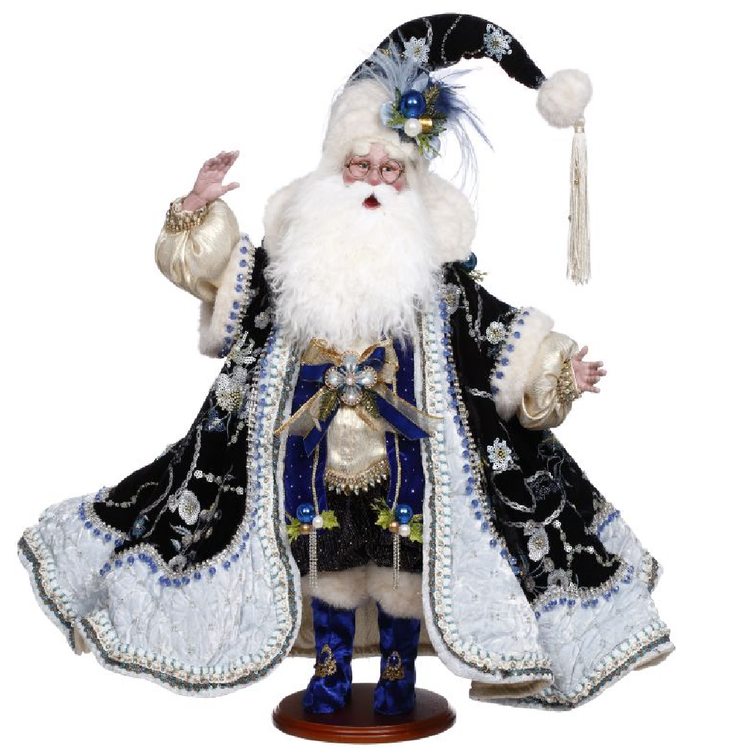 Decorative figure of a traditional Santa Claus in black and white attire with a blue robe on a white background.